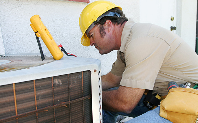 Technician Connecting HVAC to Solar Panel