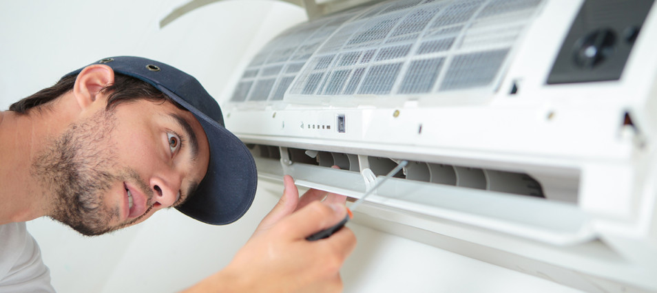 Technicial Checking Air Conditioning Unit
